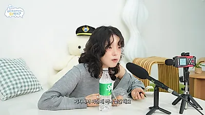 Singer Rosi embarks on a train trip to celebrate her new song release, featuring an ASMR mukbang of 10 different snacks.