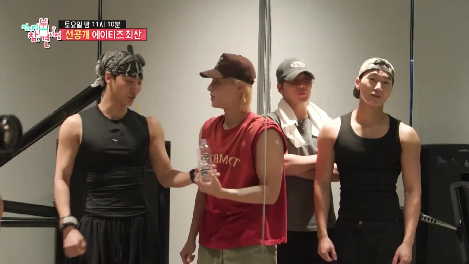 ATEEZ members offer playful encouragement during Choi San's intense chest workout